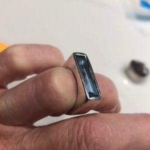 Ring with light blue stone